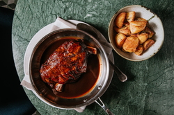 18-HOUR SLOW-ROASTED LAMB SHOULDER IN BAROLO WINE WITH AROMATIC HERBS AND TUSCAN POTATOES WITH ROSEMARY AND GARLIC