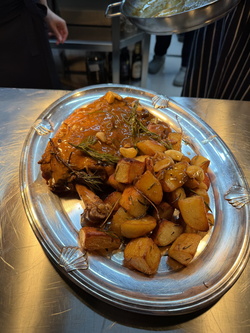 LAMB SHOULDER, SLOW-ROASTED IN AROMATIC HERBS WITH ROASTED ROSEMARY POTATOES